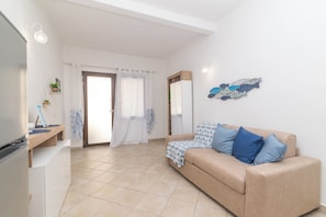 Appartement Familial, plusieurs chambres (Appartamento Mirto In The City Center) | Coin séjour | Télévision à écran plat de 21 pouces avec chaßnes par cùble, télévision