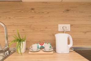 Family Apartment, 2 Bedrooms (Appartamento Mirto In The City Center) | Private kitchenette | Fridge, stovetop, electric kettle, cookware/dishes/utensils