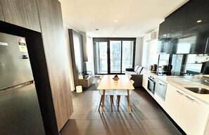 Deluxe Apartment | Private kitchen | Full-size fridge, microwave, oven, stovetop - Readyset Apartments at Hudson  (Melbourne)