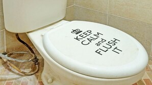 A toilet with a lid that has the text "KEEP CALM and FISH IT" printed on it. - OYO Life  92393 Namimart Syariah 1 (Kediri)