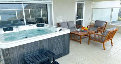 sea view penthouse with 3 floors and an hot tub! can host up to 15 people .