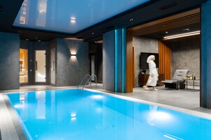 Indoor pool, open 7:00 AM to 11:00 PM, pool loungers