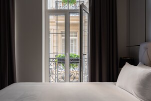 Premium bedding, down duvets, memory-foam beds, minibar