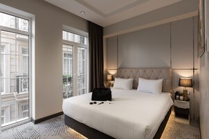 Premium bedding, down comforters, memory foam beds, minibar