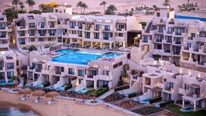 A resort with multiple buildings, a central swimming pool, and a beach area. - Creek Hotel and Residences El Gouna (El Gouna)
