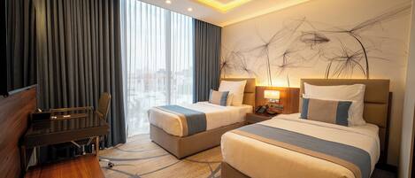 Down duvets, pillow-top beds, desk, blackout curtains