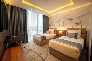 Down comforters, pillowtop beds, desk, blackout drapes