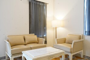 Executive Double Room | Living area | 43-inch flat-screen TV with satellite channels, table football - Spree Resort Sariska (Thanagazi)