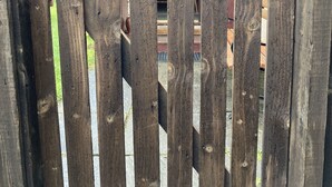 A wooden gate with a horseshoe-shaped handle. - Smithy Cottage Licence AS00607 (Strathdon)