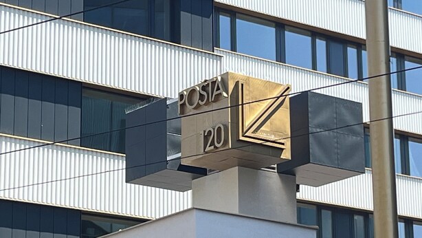 A building with a sign reading "POSTA 20" indicating a hotel or apartment complex. - Post 120 Suites (Prague)