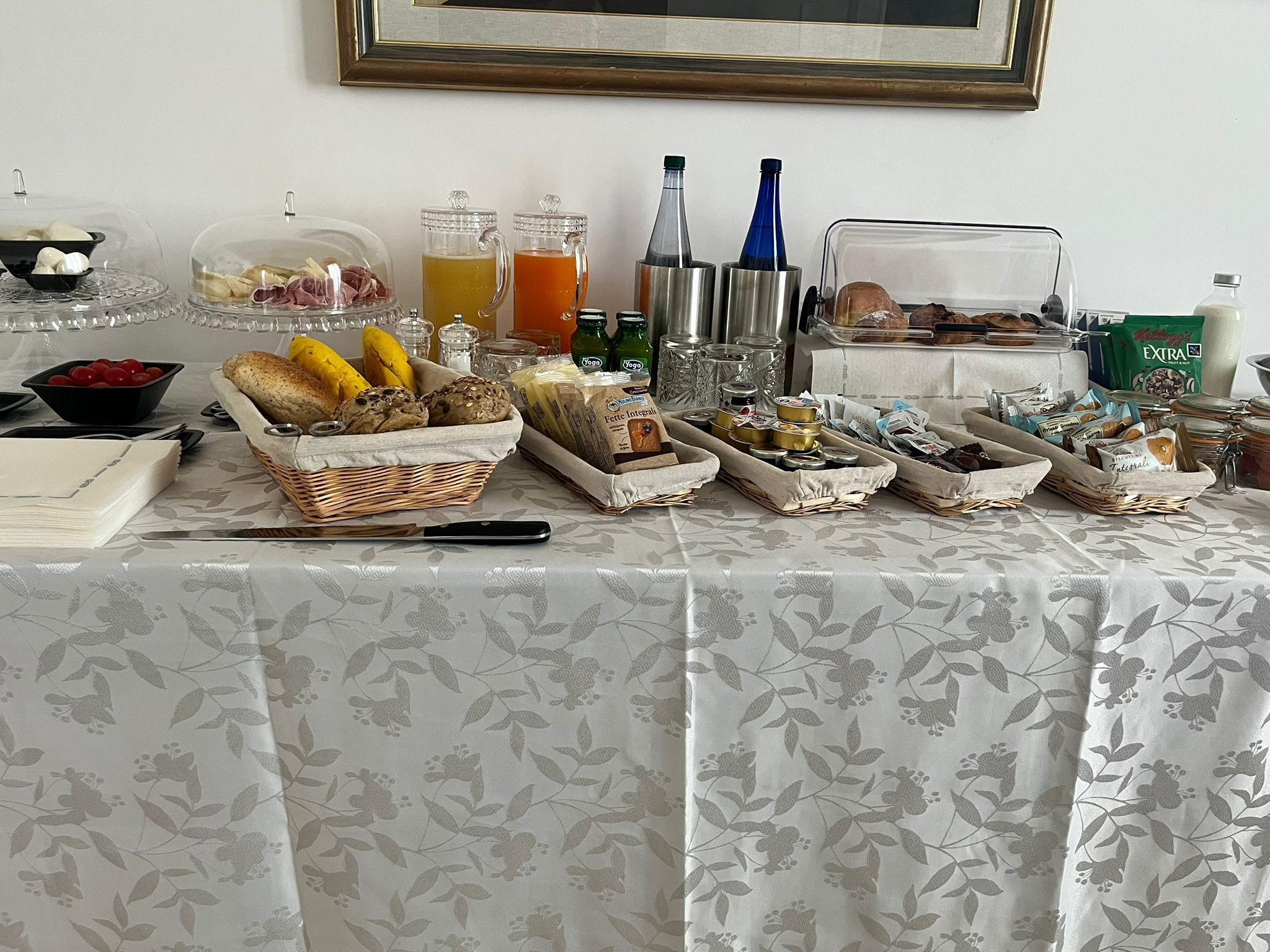 A breakfast buffet with various food items and beverages.