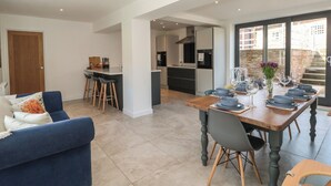 A modern kitchen with a dining area. - Bailey House (Driffield)