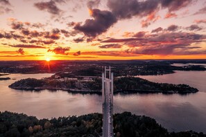 Spanning a wide river, this iconic bridge connects two land masses, offering breathtaking views of the surrounding landscape.