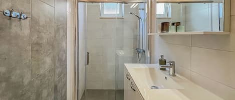 Shower, hair dryer, towels, soap