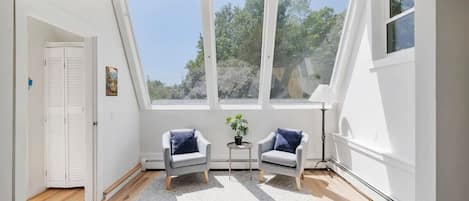 Quaint reading nook! Perfect for a cup of coffee in the morning!