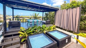 A rooftop terrace with a pool table, seating area, and two hot tubs. - Micro-Studio APT 5B, Oceanview + Pool, Near Beach | @ Paradise Point Barbados (Maxwell)