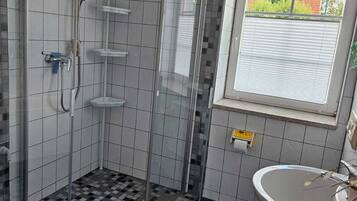 Shower, towels, soap, toilet paper