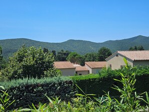 Escape to a serene countryside retreat surrounded by lush greenery and rolling hills.