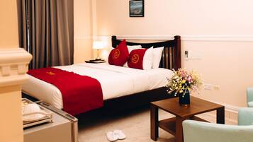 Premium bedding, desk, laptop workspace, soundproofing