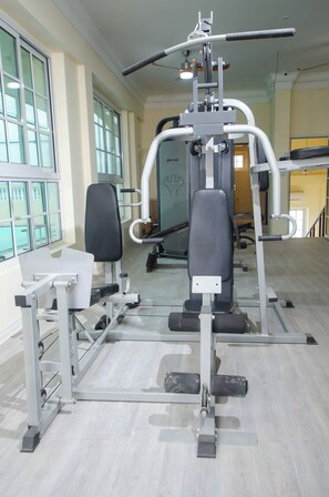 Stay fit and active in this well-equipped gym with weight machines and benches.