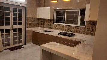 Fridge, stovetop, electric kettle, toaster