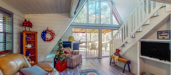 Adorable A-Frame with riverfront yard, fishing pier, & firepit