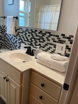 Hair dryer, towels, soap, toilet paper