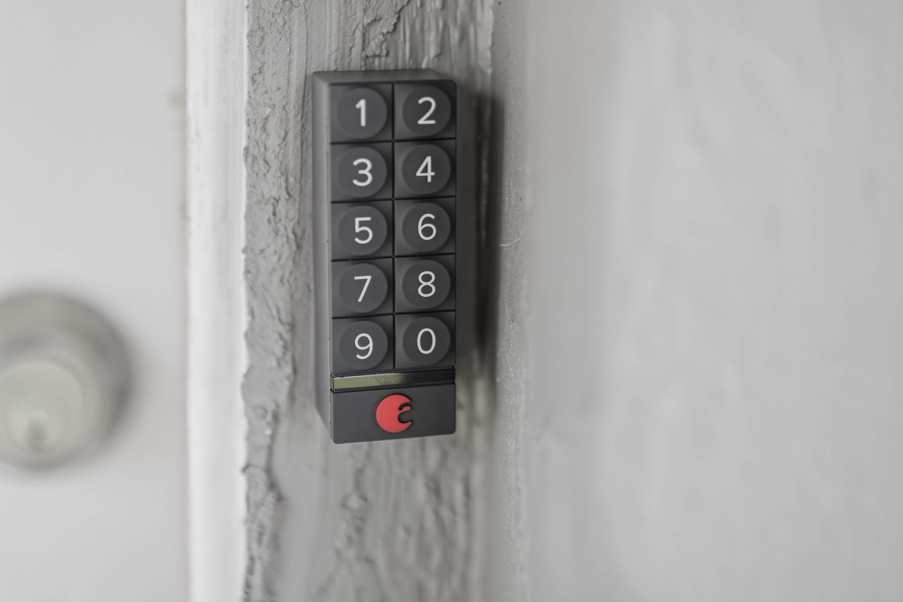 A numeric keypad lock on a door.