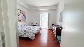 A room with a bed, a desk, a chair, a dresser, and a window. - Marechiare - Two Bedroom Apartment, Sleeps 4 (Ortona)