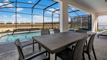 Outdoor pool, a heated pool, pool umbrellas, pool loungers