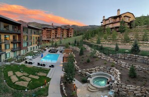 A resort with a swimming pool, hot tub, and outdoor seating area. - Lift by All Seasons Resort Lodging (Park City)