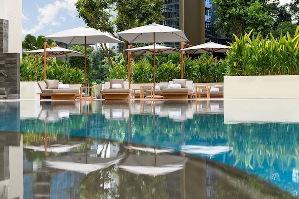 Outdoor pool, open 6:00 AM to 10:00 PM, free cabanas, pool umbrellas