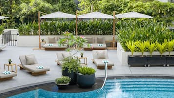 Outdoor pool, open 6:00 AM to 10:00 PM, free pool cabanas