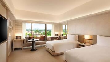 Chambre Exécutive, 2 lits une place | Coin séjour | Télévision à écran plat de 55 pouces avec chaßnes par cùble