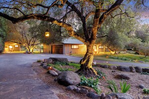 Surrounded by a lush garden, this traditional building offers a serene escape.