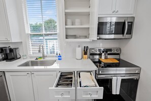 Fridge, microwave, oven, stovetop - Island Pride Coastal Cottage - 2 King Beds on the East End! (Galveston)