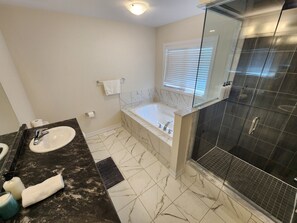 Jetted tub, hair dryer, towels, soap