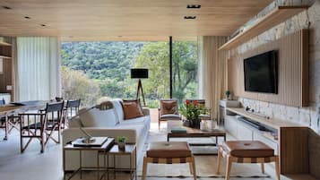 Luxury Cottage, 2 Bedrooms, Jetted Tub, Garden View | Living area | 42-inch Smart TV with cable channels, Netflix, smart speakers