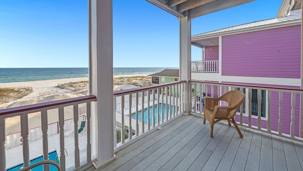 A wooden deck with a view of the beach and ocean. - Holiday Summer Sale! Sundancer E/W. 10BR. Sleeps 36. Beachfront. Pool! PERFECT location. 😎 (Gulf Shores)