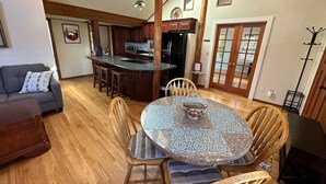A spacious living area with a kitchen, dining table, and seating. - Wonderfully located near Bay Street and all the wonderful restaurants. Sauna! (Florence)