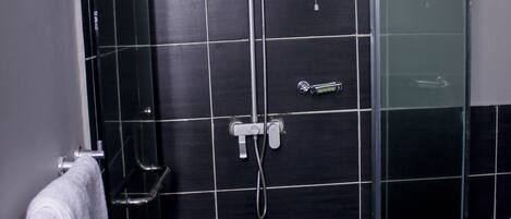 Shower, towels, soap, toilet paper