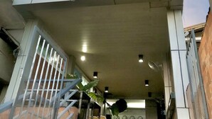 A hotel entrance with a sign reading "Sunburn Suites". - Sunburn Suites Coron (Coron)