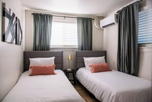 2 bedrooms, desk, iron/ironing board, travel crib