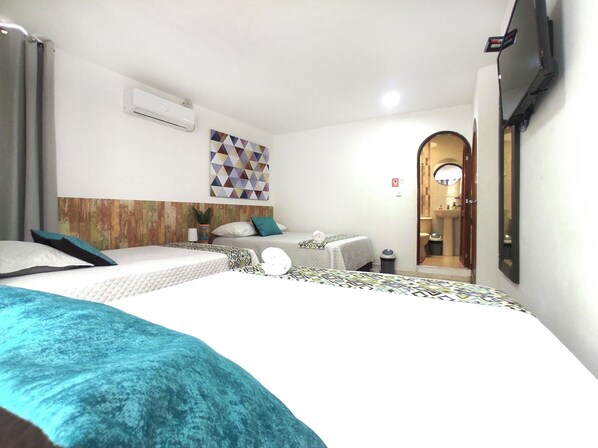 Deluxe Triple Room, 1 Bedroom | Premium bedding, down comforters, minibar, free WiFi