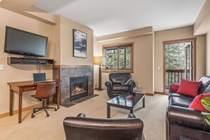 TV, fireplace - Spacious King Bed with Pool & Hot Tubs (Canmore)