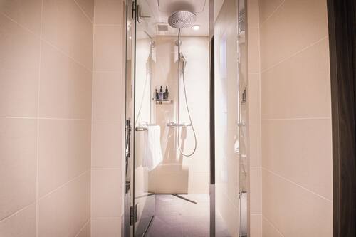 Eco-friendly toiletries, hair dryer, slippers, electronic bidet