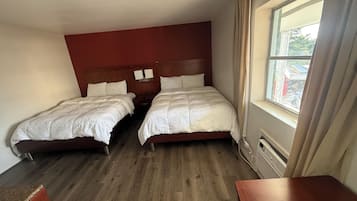 Habitación básica | Ropa de cama de alta calidad y wifi gratis