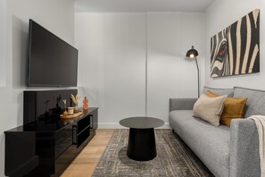 City Apartment | Living area | Flat-screen TV, pay movies