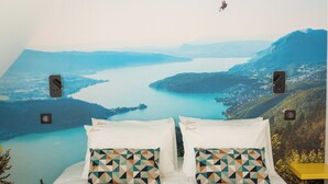 A hotel room with a large bed, two pillows, and two towels. - Lodge du Hautacam (Ayros-Arbouix)