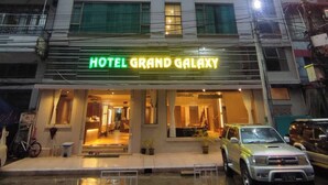 A multi-story building with a sign reading "HOTEL GRAND GALAXY". - Hotel Grand Galaxy (Yangon)